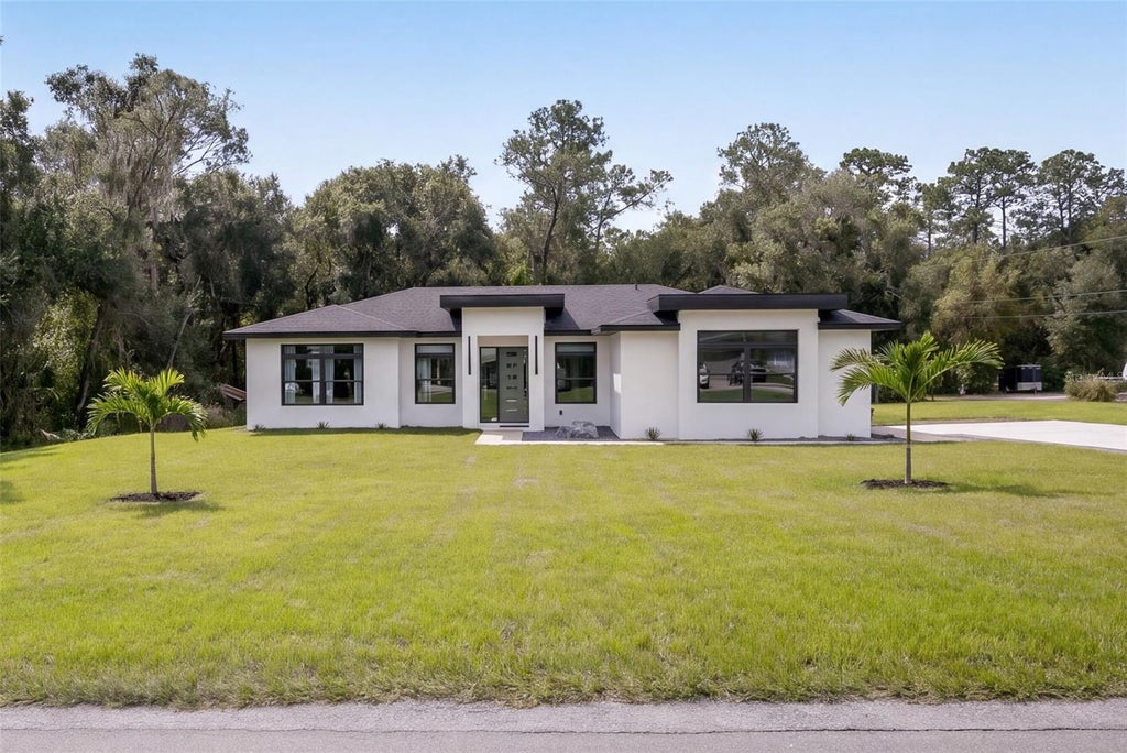 Photo of 243 Deerfoot Road, Deland, FL 32720 (MLS # O6449524)