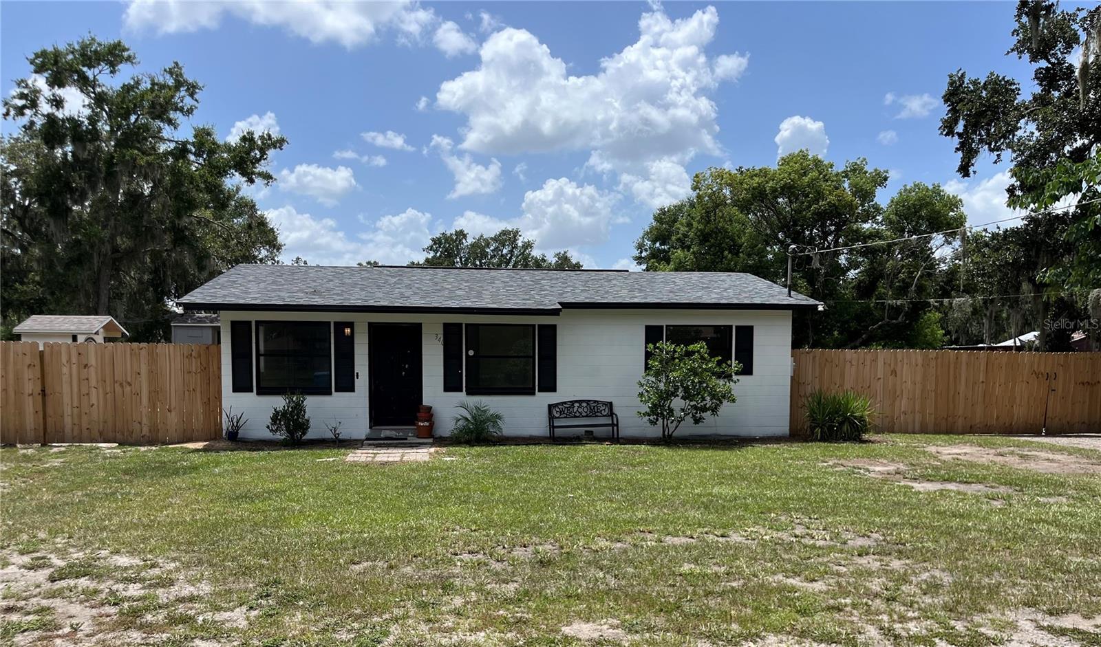 Welcome to Country Living in Plant City! This beautifully updated 2 bed, 1 bath block home on nearly ½ acre features a BRAND-NEW kitchen with quartz countertops, subway tile backsplash, and stainless steel appliances. Enjoy new luxury vinyl plank flooring throughout, an updated bathroom with quartz counters, and new fixtures. The AC is just 2 years old with new ductwork, and the ROOF is only 7 years old. Step outside to your private outdoor kitchen, lush yard with mango, peach, lime, lemon, cherry, and guava trees, and a newly fenced yard. A finished shed offers ideal space for a home office or studio. Just minutes to I-4 — don’t miss this unique blend of comfort and country charm!