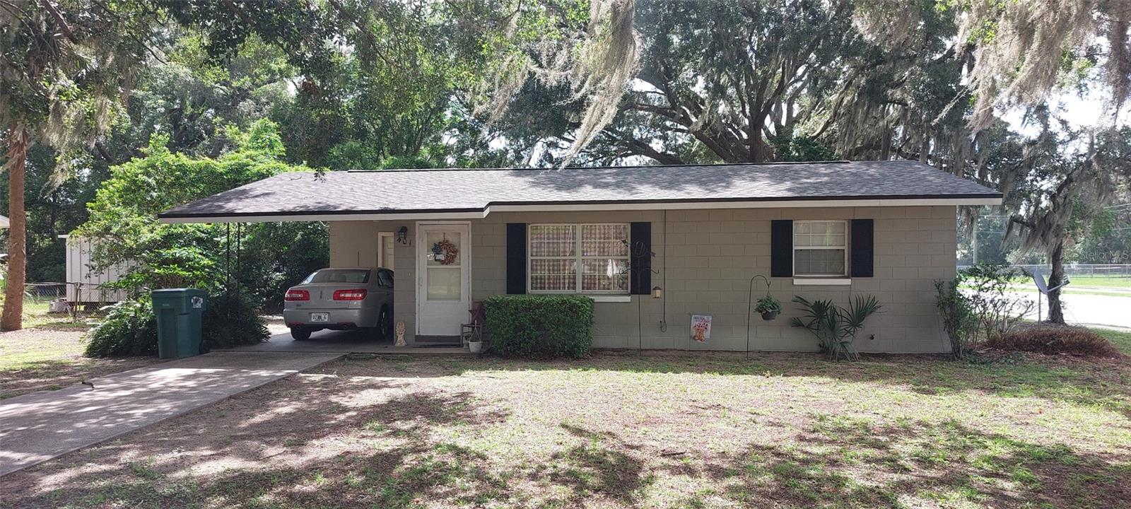 This 945-sq ft 2 bedroom/1 bath concrete home is on a very desirable corner lot at 466A and Sunny Ct in Fruitland Park, FL. This property is zoned R-P so it can be used as a residential home or a professional office. New roof and upgraded 200 amp underground electrical service in 2023. 466A (also known as Miller Blvd) serves as a key connector through The Villages, lined with retail, medical, and professional development, positioning this area for strong traffic and customer flow. County Road 466A is under rapid transformation into a major mixed-use corridor. There is a tenant currently in the home but who is willing to stay or to vacate within 30 days.