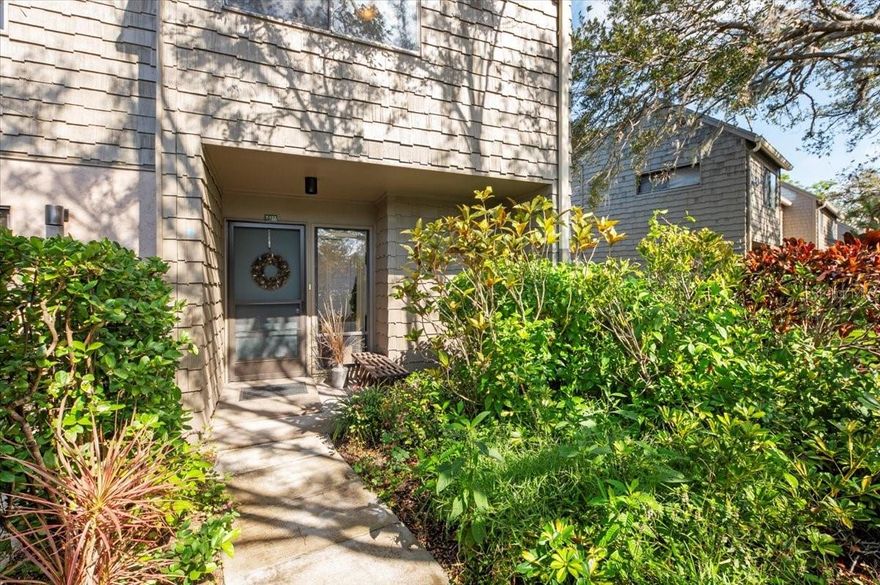 This 3-bedroom, 3-bath treehouse is the epitome of gracious living. Its blend of open concept and generously sized rooms, soaring cathedral ceilings, abundant light and storage, front and back patios and a screened-in sitting area off the primary upstairs bedroom make this a stylish and welcoming home. In addition, there’s a downstairs family room/den, a separate laundry utility room, and a secure external storage shed and covered carport. A thoughtful renovation in resulted in a completely remodeled kitchen and flooring throughout.  Upon entering, you will immediately be enchanted by the opened kitchen walls, laminate flooring throughout and the sun beaming through the back window wall will further draw you in.  This lovely residence is well-situated within the lush beauty of this popular condo enclave—just steps from its front patio is the Harbor house and lap pool.  To sum up, if you are looking for wonderful home where you can entertain, host family and friends, and enjoy the warm community of Pelican Cove with its myriad of activities and cultural events, your search ends here.