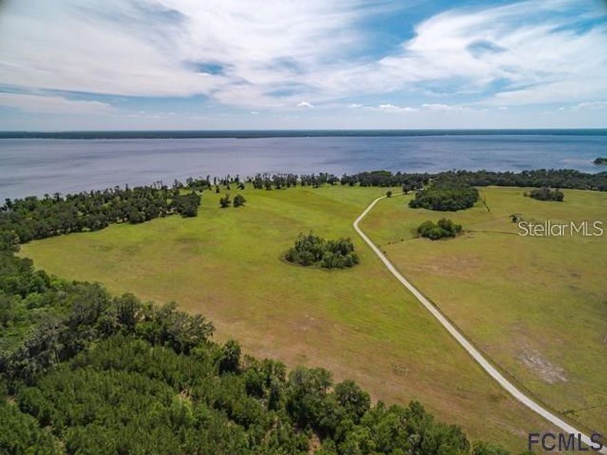 Welcome to Andalusia Bay, a one-of-a-kind waterfront equestrian community where wide-open spaces and endless possibilities await. This incredible 10.3-acre homesite (Lot 25) offers the perfect canvas to create your dream estate, whether that means a private homestead, a working ranch, or a stunning custom home surrounded by nature. Set along the scenic banks of Crescent Lake, Andalusia Bay combines the charm of rural living with the luxury of space and privacy. Imagine waking up to peaceful sunrises over the water, enjoying afternoons spent boating, fishing, or horseback riding, and ending each day with breathtaking views of Florida’s natural beauty—all from your own backyard.
With generously sized parcels ranging from 5–10 acres, this exclusive community was designed for those who value both land and lifestyle. Here, you’ll have room to spread out, build, and truly make your property your own. Whether you envision a modern farmhouse, a classic equestrian estate, or a serene waterfront retreat, this lot provides the rare opportunity to bring that vision to life. Andalusia Bay is not just a neighborhood—it’s a destination for those seeking space, freedom, and connection to the outdoors, while still being within reach of modern conveniences. Opportunities like this are rare, and Lot 25 is ready for the next owner to turn it into something extraordinary. Don’t miss your chance to claim your piece of Florida paradise.