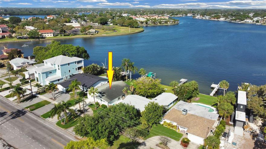 Unsurpassed opportunity to purchase a waterfront property at an incredible price! Beautiful 60’ x 130’ property with a newer seawall (2022), dock with 7,500lb boat lift and direct open views (due west) of Smack’s Bayou. Enjoy gorgeous sunsets while you watch manatees and dolphins swim by your dock. Boat directly out to the Bay in just a minute or two! Photos show the property prior to Helene. Existing block home is a tear down. This property is being offered for land value only. This property is conveniently located mere minutes from the Vinoy Golf Club, the 4th Street N shopping corridor and vibrant downtown St. Pete’s waterfront parks, nightlife, shopping, museums, waterside parks, fabulous restaurants, concerts, festivals, sporting events, and so much more. Property also is conveniently located minutes from I-275 for easy access to Tampa International Airport, downtown Tampa, and all points south. Dock size listed is inaccurate, buyer to verify dock measurements. Boat lift did not take on any water during Helene and should be fully functional.