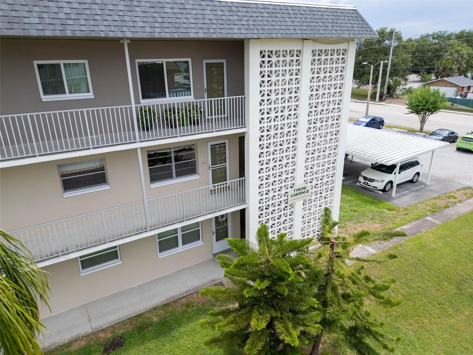 One or more photo(s) has been virtually staged. Rare End Unit Gem in 55+ Tyrone Gardens – Bright, Spacious & Perfectly Located. Welcome to the warm embrace of Tyrone Gardens, a peaceful and friendly 55+ community where comfort and convenience come together. Tucked away in one of the most desirable parts of the building, this rare end unit offers a unique opportunity to enjoy low-maintenance living in a light-filled, 2-bedroom, 2-bathroom condo. As you step inside, you’ll immediately notice the open, airy feel of this home. The bonus Florida room, bathed in natural sunlight, is the perfect spot for your morning coffee or quiet evenings with a book as you take in tranquil views of the lush, private courtyard below. Located just steps from the elevator, with a parking pad directly below, loading and unloading couldn't be more convenient. There’s also a locked storage area close by and a laundry room conveniently located near the unit. Love to entertain or unwind outdoors? Spend your evenings grilling in the courtyard, joining neighbors for friendly get-togethers, or simply soaking in the breathtaking Florida sunsets. Additional features include: Pet-friendly building, assigned covered parking plus plenty of guest parking, close to shopping, dining, and entertainment. Just minutes from Gulfport, downtown St. Petersburg, our stunning gulf beaches, and just a short drive to Tampa International Airport. Whether you're searching for a year-round residence or a seasonal escape, this condo combines the best of Florida living with unbeatable location and community charm. Opportunities like this don’t come around often—schedule your private showing today!