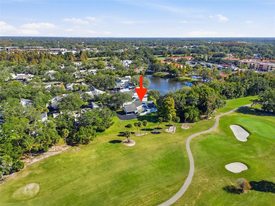 One or more photo(s) has been virtually staged. Experience maintenance-free condo living with the space, privacy, and feel of a single-family home in the highly desired Northmeadow neighborhood of Carrollwood Village. This rare end-unit offers beautiful, nature-filled views of a tranquil pond, a wooded backdrop, abundant bird life, and views of the Carrollwood Country Club Golf Course—creating a setting that feels like a true oasis. Enjoy the tranquility and views of the peaceful natural scenery from the enclosed porch, backyard, or from the home’s many vantage points. 

The one-story 1,752 square foot layout includes 3 bedrooms, 2 baths, ample living spaces, exceptional storage, quiet interior construction, and direct access from the carport with a gently sloped sidewalk. The 12.5" thick walls between the units are soundproof with floating studs and acoustic sound caulking. The living spaces are open and bright and allow for gorgeous views. One of the bedrooms has a sitting area perfect for reading or setting up a home office. The other bedroom has sliders into the large screened-in lanai.  Enter the lanai from the living area as well where you can create an outdoor living space for relaxing or entertaining. You won't lack storage with a walk-in closet in the master bedroom, large dual closets in the other bedrooms and in both hallways. The kitchen has a generous pantry and an inside laundry with ample shelving. For even more storage, you have  2 separate attics, one inside the home and the other above the carport with drop down steps for easy access. Off the carport, there's also a large storage unit. Condo fees cover exterior maintenance, roofing, painting, landscaping, pond upkeep, insurance, pool maintenance, private road and driveway maintenance, and professional property management This home also offers excellent potential for value-enhancing updates that would further elevate the home's market value, particularly given its premium location and unique water and golf course views. Northmeadow is a well-maintained community of 60 homes across 17 acres of mature landscaping. Residents enjoy a private road along with a large pool and an outdoor gathering area where neighborhood socials are held. You'll love all the amenities that Carrollwood Village has to offer such as parks, gardens, lush greenery, a dog park, and annual fireworks display. It's also a short distance to the Carrollwood Country Club and its Tennis and Aquatics Center featuring a heated pool, furnished cabanas, a splash pad, 8 lighted HydroCourt tennis courts, a fitness center with classes, a restaurant offering casual and fine dining options and 27 holes of Championship Golf. In close proximity, enjoy numerous amenities, extensive shopping and dining options, medical facilities, parks, fitness options and so much more. Schedule a tour today for this prime opportunity.