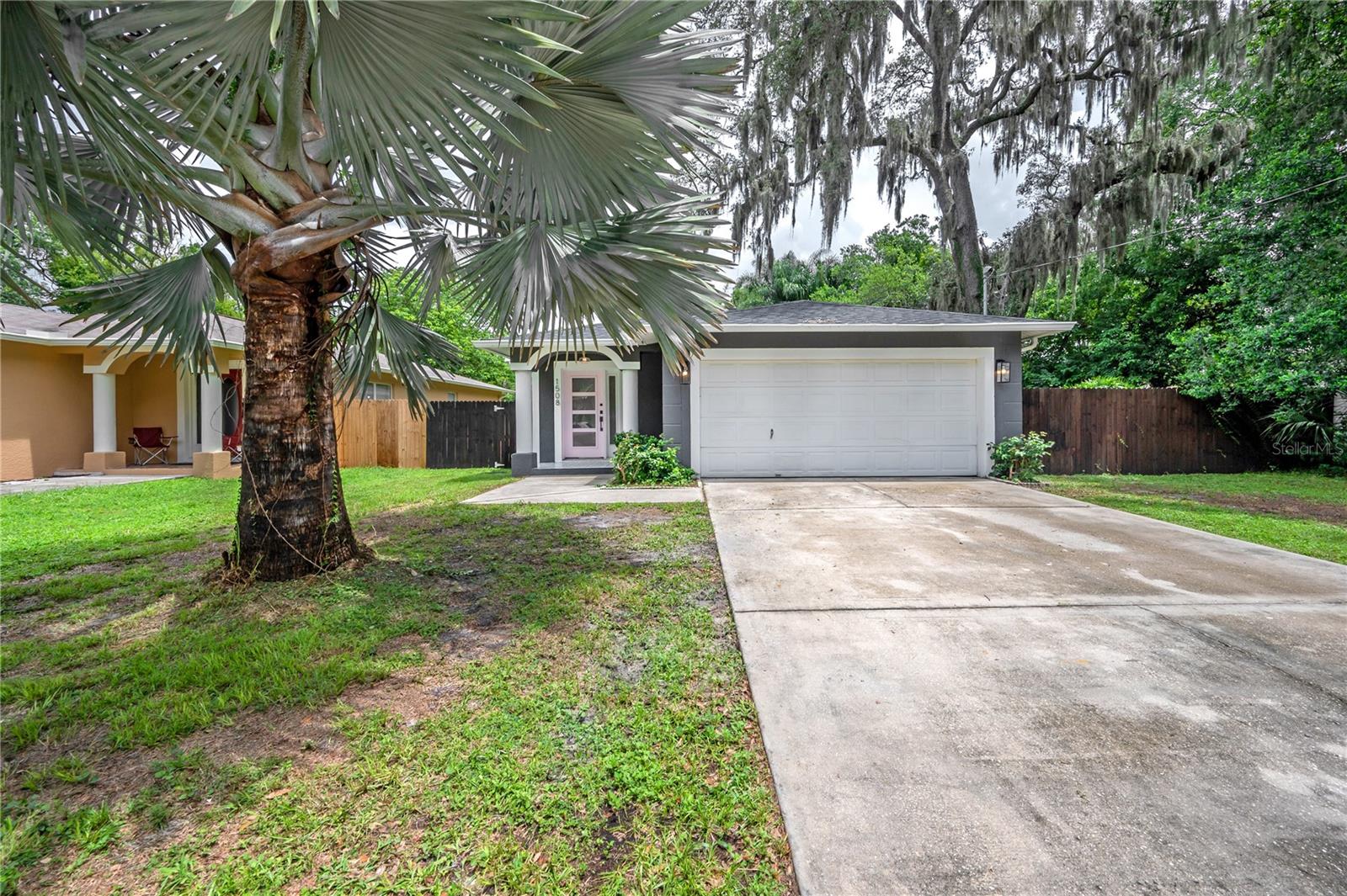 Live in the heart of Seminole Heights, just minutes from the neighborhood’s favorite spots like Independent Bar, Cappy’s Pizza, Corner Club, and Angry Chair Brewing. Publix is right down the street, and you’ll have quick access to I-275, Downtown Tampa, Amalie Arena, and the Tampa Riverwalk.
This block construction home blends the charm of the Heights with the peace of mind of newer updates. A newer roof, newer HVAC, brand new septic system, and brand new privacy fence mean less maintenance and more comfort. The open-concept floor plan connects the kitchen, living, and dining areas, while a custom-built mudroom nook sits just inside from the 2-car garage.
The kitchen is a standout, featuring painted sage green cabinetry, quartz countertops, herringbone glass subway tile backsplash, stainless steel appliances with a slide-in range, a custom-built hood, and open shelving. Durable vinyl flooring runs throughout the living spaces and bedrooms, and the primary suite offers a private ensuite bathroom.
Step outside to a huge backyard with a detached shed and a screened-in lanai — perfect for relaxing or entertaining. This home offers style, space, and a prime location in one of Tampa’s most vibrant neighborhoods. Call today!
