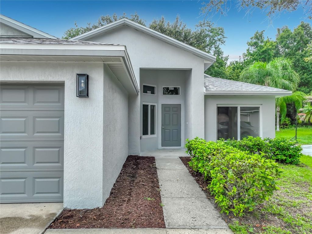 Photo of 11148 Pinewood Cove Lane, Orlando, FL 32817 (MLS # O6426927)