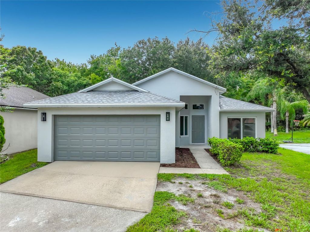 Photo of 11148 Pinewood Cove Lane, Orlando, FL 32817 (MLS # O6426927)