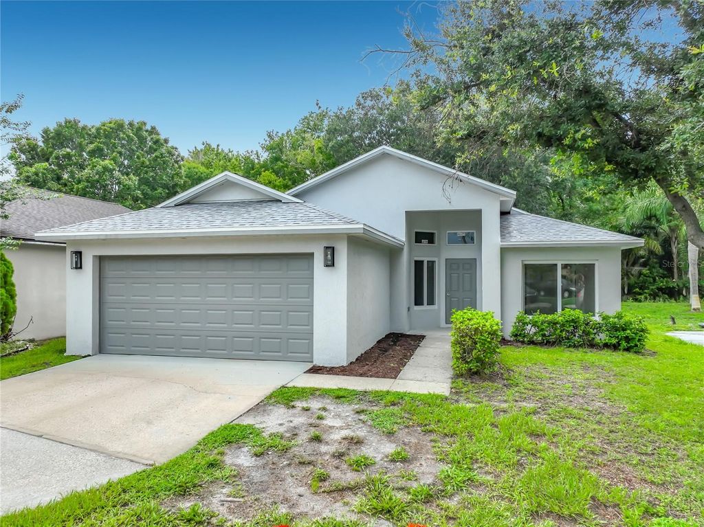 Photo of 11148 Pinewood Cove Lane, Orlando, FL 32817 (MLS # O6426927)
