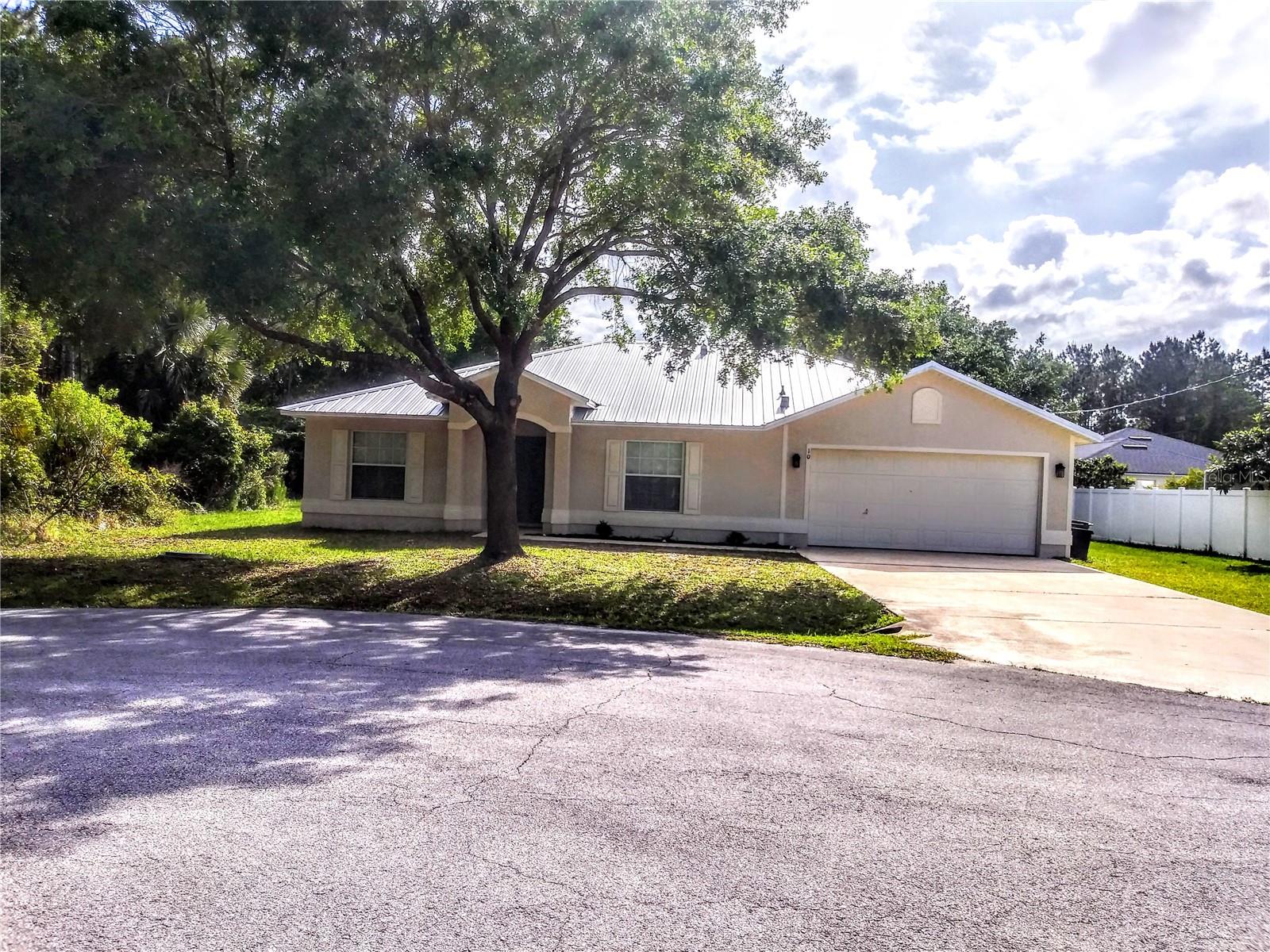 One or more photo(s) has been virtually staged. Charming Updated Home in Matanzas Woods – No HOA!
Located at the end of a cul-de-sac, this beautifully updated 3-bedroom, 2-bath home offers comfort, style, and convenience in the desirable Matanzas Woods community. In 2022, the home underwent thoughtful renovations, including luxury vinyl plank flooring, a remodeled kitchen with stainless steel appliances and granite countertops, modernized bathrooms with matching granite surfaces, updated lighting and fixtures, and fresh interior paint—creating a bright and move-in-ready atmosphere.
The spacious living area is open and airy, enhanced by vaulted ceilings and two skylights that flood the home with natural light. A split floor plan provides privacy, while generously sized bedrooms provide ample closet space.
Step outside to relax or entertain in the covered, screened-in lanai, overlooking a large backyard with plenty of room for a future pool or garden. Additional updates include a new metal roof (2022), newer A/C unit (2019), a 2-car garage, paved driveway, and low-maintenance block construction.
Conveniently close to shopping, schools, golf courses, and just a short drive to Flagler Beach, this updated home combines modern finishes with a quiet, no-HOA location—making it the perfect Florida retreat.