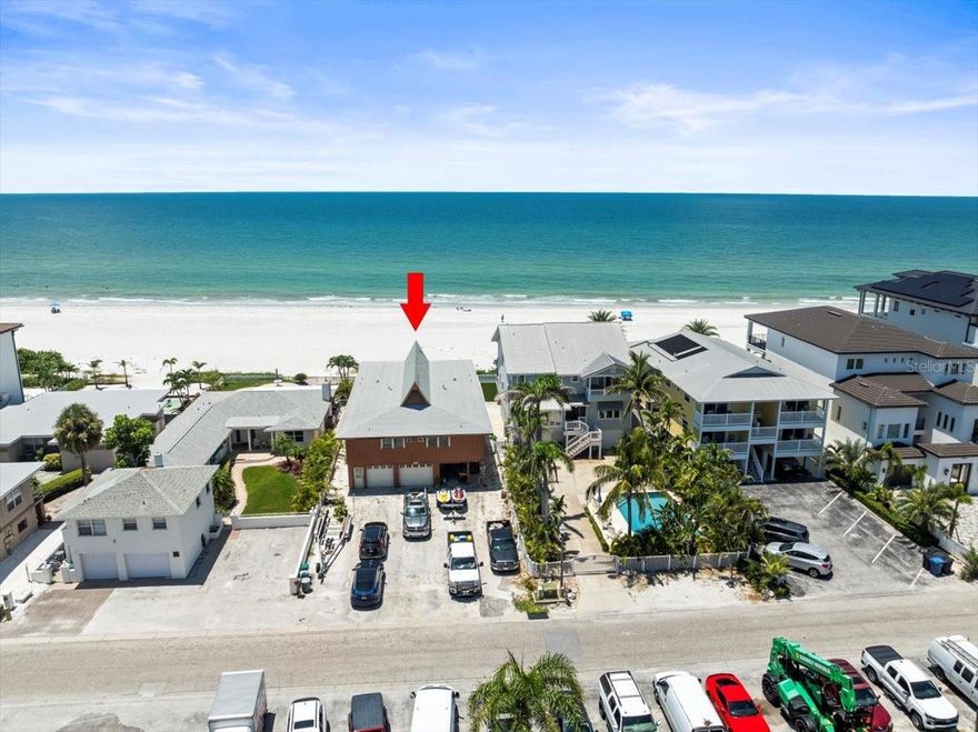 HUGE price improvement: A rare opportunity has arrived in Redington Shores: a direct Gulf-front property offering unparalleled potential for both luxury living and lucrative investment. For the first time in over 30 years, this prime piece of real estate is available to the market. Currently zoned as a condo with 2 separate raised units, the property has been cherished as a family vacation retreat, with both units totaling 2,750 sq. ft. of living space—each featuring 3 bedrooms and 2 bathrooms. The existing structure boasts a large parking pad, two one-car garages, and under-building storage, adding functionality to its enviable beachfront location. There is over 50 feet of Gulf frontage and a Sea Wall Already in place and the City provides a Beach scraper to keep the beach front view clean and free of debris.

Another rare advantage: this property does not back up to Gulf Boulevard, providing a quieter, more private atmosphere with Constitution Park buffering the rear of the property, which has a dog walk, playground and town sponsored cookouts and events for residents. Just steps away, you’ll find the beach trolley, bus stops, local favorites like Candy Kitchen, Coco Wood Grill, Friendly Tavern, and Broke N Board, plus easy access to restaurants, coffee shops, and the famous Beach Pizza. The lot itself, just under a quarter acre (see attached survey), offers impressive development potential. The City of Redington Shores allows underground parking/storage and up to two floors of buildable space, with the potential for a third floor with variance approval.

The possibilities are endless: design a spectacular 2,500+ sq. ft. Gulf-front penthouse for your own use while generating income from luxury rental units below, or create a boutique Gulf-front development perfectly tailored for today’s high-end buyers and investors.  Possibly two smaller buildings with a variance? All this, while being only 30 minutes to Tampa—home of the Buccaneers, Tampa Bay Lightning, the Rays, fine dining, international shopping, Broadway-caliber theater, and an international airport. Just minutes away, St. Pete offers a vibrant nightlife and its iconic new pier, while Clearwater Beach adds yet another world-class destination to the mix.