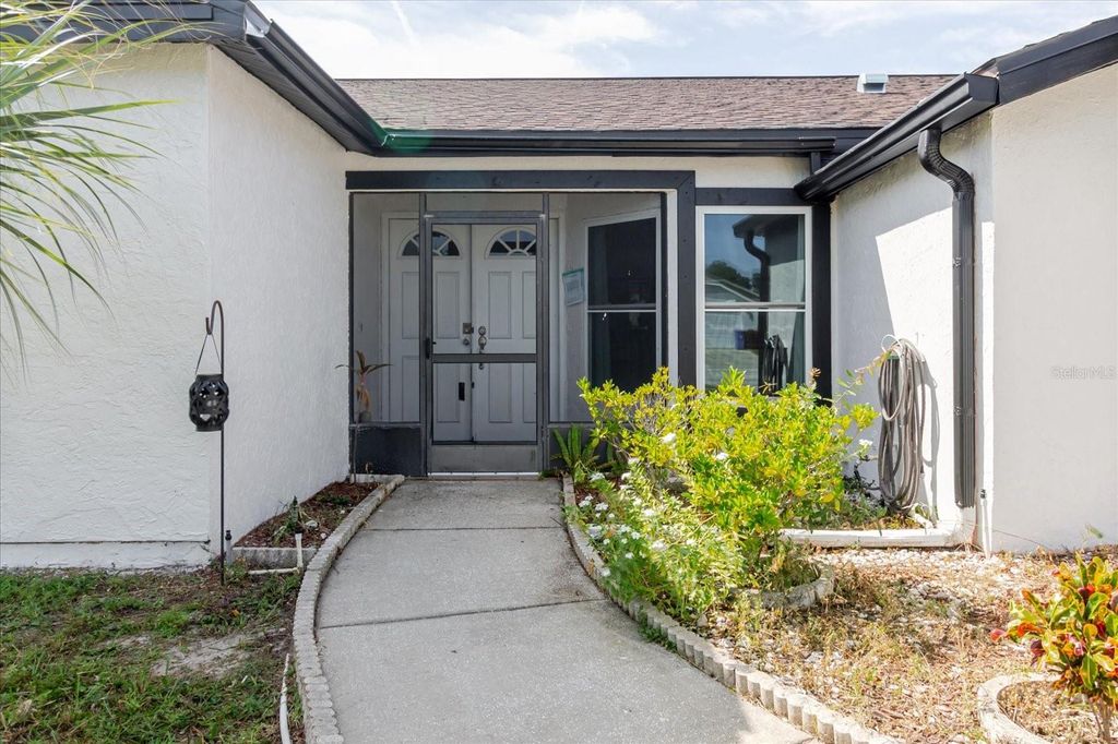 Photo of 8450 Royal Hart Drive, New Port Richey, FL 34653 (MLS # O6346560)