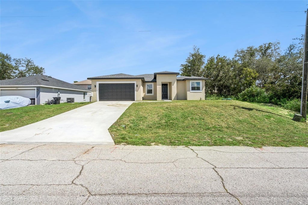 Photo of 1444 Sarasota Drive, Poinciana, FL 34759 (MLS # O6444635)