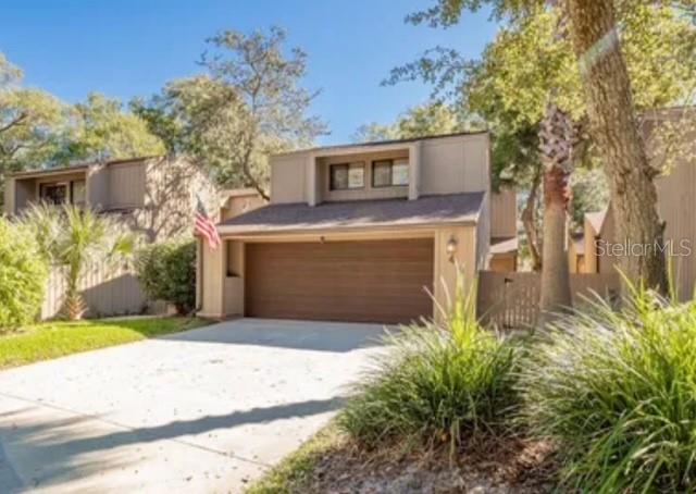 This centrally located beautifully designed two story home inside the Trails with detached garage has been meticulously maintained and ready to make your own! A beautiful oversized master bedroom welcomes you to this renovated upstairs suite with large master bath and massive shower and his and her vanities. Two bedrooms and full bath are located upstairs with ability for an office for privacy upstairs. The living room adorns a gorgeous stone wood burning fireplace which opens to a formal dining room, leading out to an open outdoor patio and courtyard for planting a garden or growing herbs. Plenty of room for entertaining guests and the kitchen has everything you need and more. Stainless steel appliances and adorable space for kitchenette and bar area. Kitchen sliders lead to a cute front patio and courtyard along with access to a separate garage. The two car garage has plenty of room for storage, freezer and laundry. If you are looking for an incredible place to live with convenience to shopping, beaches, bike/walking trails and parks and recreation, this property is located in the perfect spot! Priced to sell and ready to go!