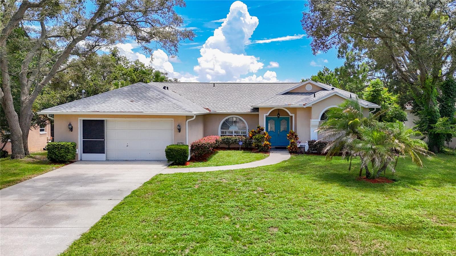 You will be completely impressed with this updated 3-bedroom, 2-bath-pool home in the heart of Spring Hill. As you enter, the tile entrance will lead you to the spacious living room featuring cathedral ceilings with sliding doors that lead you to the pool. The separate formal dining room leads to the updated, eat-in kitchen which has ample space for all your cooking needs. You will love the newer stainless-steel appliances, refaced cabinets, granite counters with extended bar seating that is perfect for family gatherings. The eat-in area offers large windows that overlook the stunning pool. The roomy master bedroom en-suite has cathedral ceilings, and double walk-in closets. The updated master bath features double sinks with refaced cabinets, granite counters, a garden tub, a separate tile shower and a new toilet. The convenient split-plan design provides ample privacy with the large 2nd & 3rd bedrooms share the 2nd bath. The 2nd bathroom has also been updated with granite counters, refaced cabinets and a new toilet. Step out back to the expansive lanai to enjoy a peaceful evening or your morning coffee by the diamond brite pool as you look out to your fenced backyard. This incredible home sits on a spacious lot with a large front porch. Other amazing features include a brand-new roof (2025) with a new skylight, AC (2014), new garage side door (2025), outdoor pool shower, tile throughout the whole house, sprinklers and new gutters and gutter guards. Lots of shopping and favorite local dining options nearby. Minutes from the famous Weeki Wachee live mermaids, Pine Island Park and Roger’s Park for fun on the water. Close to the Suncoast parkway for quick access to the airport, Tampa, Clearwater and St. Pete Beaches (Ranked in the top 5 Beaches in the US), also close to the famous Tarpon Springs Sponge Docks. Enjoy everything Tampa Bay has to offer from the new Downtown Riverwalk, TOP US BEACHES, boating, fishing, golfing, cultural entertainment, and museums...and of course beautiful year-round weather!