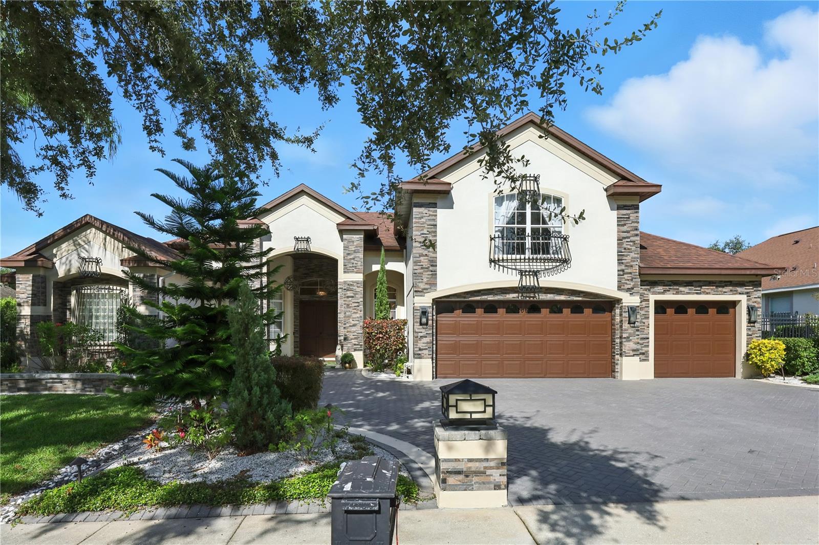 Welcome to 3432 King George, a stunning 4-bedroom, 3.5-bathroom home offering over 3,500 sq. ft. of luxurious living space. As you first arrive, the grand elevation immediately makes a statement with its paver stone driveway, elegant tile and ironwork, and an oversized 3-car garage that sets the stage for what’s inside.
Step in and discover modern upgrades, high-end finishes, and designer light fixtures throughout. The gourmet kitchen is both functional and glamorous—perfect for everyday living or hosting unforgettable gatherings.
The expansive primary suite is a sanctuary, complete with a spa-worthy bathroom designed for ultimate relaxation. All bedrooms are generously sized, offering large closet space and direct bathroom access, making comfort and convenience a priority for everyone. Upstairs, a spacious flex area provides endless possibilities, whether you need an office, fitness room, or media lounge. In addition, the home includes a dedicated office downstairs, offering a quiet and private workspace separate from the main living areas.
The backyard and patio are the true stars of the show. This resort-style escape features a sparkling pool and spa surrounded by a paver patio, a dream outdoor kitchen, and a covered bar with built-in grill, refrigerator, and more—ideal for both intimate evenings and large-scale entertaining. The fenced-in yard includes an artificial turf run area, adding function to the glamour. Even better, pool and lawn maintenance are included, leaving you free to simply relax and make the most of this incredible space.
Available October 1st for a 12-month lease, this home can be offered fully furnished as a corporate rental, partially furnished, or unfurnished—just bring your toothbrush and step into luxury. Tucked within a gated neighborhood near Windermere, Dr. Phillips, major highways, Disney, and Universal, it delivers both elegance and convenience in one spectacular package.