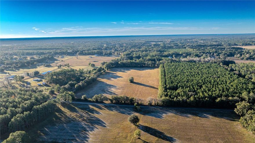 This exceptional 19.7± acre rolling property presents a rare opportunity to create your dream farm, private estate, or rural retreat in the heart of North Central Florida. Showcasing gently rolling hills, and abundant native wildlife, the land offers a peaceful and scenic backdrop with the space and flexibility to bring virtually any vision to life. Fronting a public paved road, the property provides convenient access while preserving a quiet country atmosphere, and its FEMA X designation adds confidence for future development. With wide-open acreage and no existing improvements, this is a true blank canvas ideally suited for a custom home, equestrian use, agricultural pursuits, or a private homestead designed entirely to your specifications. Perfectly positioned for animal and outdoor enthusiasts, the property is approximately 21 miles to the World Equestrian Center, 23 miles to Gainesville Regional Airport, and 30 miles to the Florida Horse Park, with Daytona, Tampa, and Orlando all within an easy two-hour drive. Opportunities of this size, quality, and location are increasingly rare—bring your plans and transform this remarkable property into something truly special.