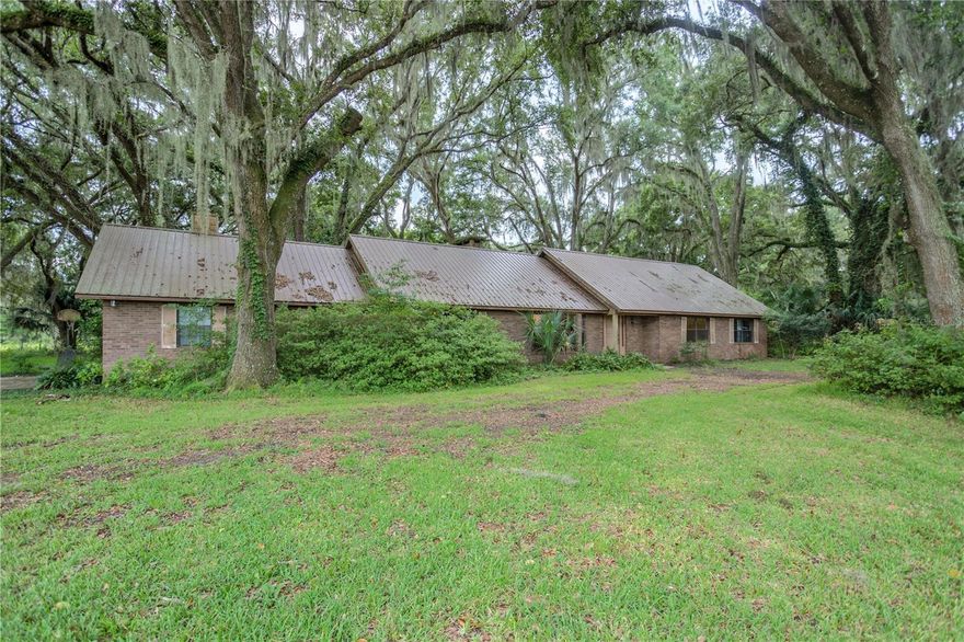 117 acre ranch in Hawthorne with road frontage on SR 20 and Cr 2082. Absolutey stunning property with lush pasture, live oak hammocks throughout, a small stream travels the northern portion of the property and empties into a small pond.  Rails to trails runs along the southern boundary. The 3227 sf brick home features a large kitchen with breakfast nook overlooking lush pasture canopied by century live oaks, a good sized living room, separate dining room, family room with bar and fireplace, 4 bedrooms, 4 baths, and much, much more. The property is fenced and crossed fenced for horses, cows and other livestock. The property consists of about 3/4 improved pasture with scattered century live oaks and hammocks. On the property you will also find a variation of fruit trees such as peach, navel, banana, pare and avocado to name a few!  Recently added is a fenced riding arena (on grass) that is Olympic size.  This is a unique property that even has a platform with a bubble tent to enjoy a beautiful night underneath a starry sky (photos coming soon).