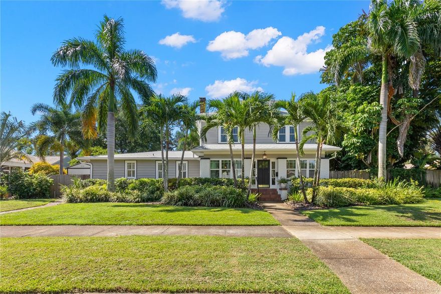 This newly renovated 1925 Historic Old Northeast home spared no expense in blending period finishes with the modern conveniences of today. Not only is it high and dry but the home is situated on an oversized lot with a large pool and plenty of backyard, a downstairs primary suite (a rarity in the neighborhood) and has a detached guest suite with a full bath and kitchen. In addition to the designer custom finishes and renovations throughout there are oak hardwood floors, plantation shutters, a new roof, impact windows, updated plumbing, a tankless water heater, water filtration system, newer A/C systems and Icynene insulation in the attic for greater energy efficiency. Greet your guests on the inviting enclosed front porch which opens to the living room with wood burning fireplace, custom built-ins with an adjacent sitting room or home office. Warm and casual best describes the living space with the dining, living and family rooms all open to one another. The gourmet kitchen features a peninsula for bar seating open to the dining room, subway tile, quartz countertops, natural gas range with pot filler, two refrigerators and freezers, a separate ice maker and walk-in pantry. Lots of entertaining space in the family room with a bar, convenient powder bath, and French doors leading out to the backyard oasis.  There is a screened-in patio off the primary suite. The spacious downstairs primary suite boasts French doors overlooking the pool and offers a large walk-in closet, designer custom bath with marble tile, shower with dual shower heads, claw-foot tub, and dual sinks. Upstairs are four additional bedrooms, one of which is a guest suite with an en-suite bath, a daybed/reading nook and large closet. The other three bedrooms share a hall bath with a bathtub and shower. Plenty of parking in the drive space, on the parking pad with alley access, or on the wide front street. Schedule a private showing today and start living the Florida lifestyle in a great location with an easy stroll to coffee shops and restaurants on 4th street or to the vibrant downtown St Pete and waterfront!