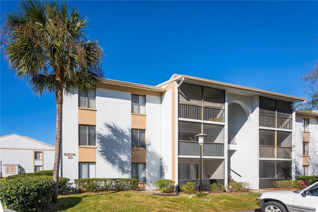 Second-floor two-bedroom two-bath condo with a covered/screened-in balcony in the gated community, The Club at Orlando. This home has been updated with the following: AC, stainless steel appliances, a washer/dryer, laminate floors throughout, baseboards, paint, quartz countertops in the kitchen, and vanities in the bathrooms. A reserved parking spot and storage unit are included with this unit. The community just made significant exterior upgrades, including roofs, asphalt, and a gate entry system. The community features a pool and spa, tennis courts, and a walking trail! Water, cable TV, sewer, and trash are all included.
