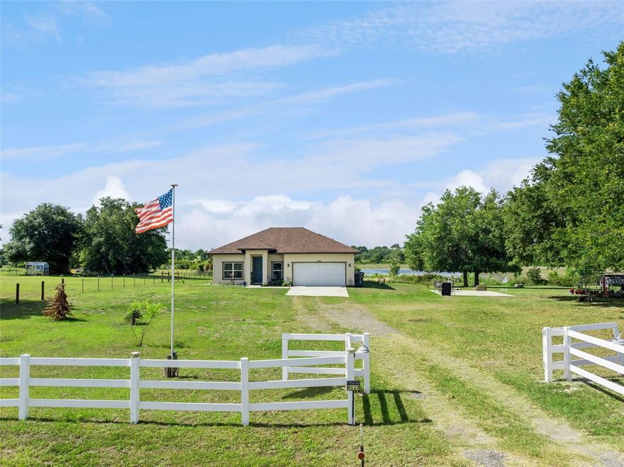 TRANQUILITY ON THE LAKE with this CUSTOM BUILT 3 BEDROOM/2 BATH HOME BY LARRY GOECKE HOME BUILDER. Home built in 2022 with numerous upgrades. Foam insulation, luxury vinyl floors throughout, vaulted ceilings, volume ceilings, oversize island with plenty of area for bar stools, granite counter tops, and stainless-steel appliances. After a long day at work just relax with your favorite beverage while sitting in the screen Lanai and enjoying the lake view of Blue Spring Lake. There are 2 storage sheds, firepit, and vinyl fence with the property. Less than 15 minutes from Lake Harris, restaurants, and golf. Be to the major attractions, Orlando International Airport, major shopping centers, restaurants, and government centers all under an hour. This FANTASTIC property has everything you been looking for. Schedule your privat showing today. Don't miss out!!!