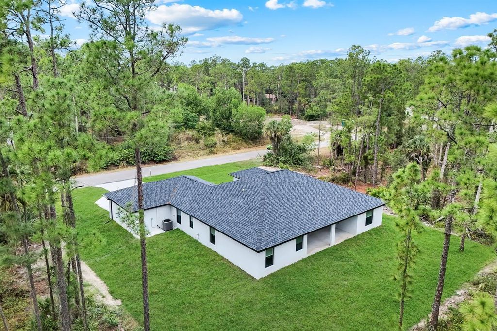 Photo of 1102 Edison Avenue, Lehigh Acres, FL 33972 (MLS # TB8456454)