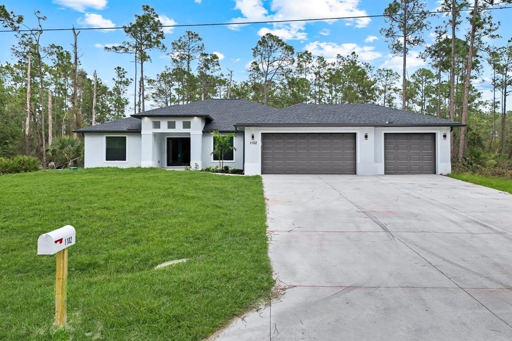 Photo of 1102 Edison Avenue, Lehigh Acres, FL 33972 (MLS # TB8456454)