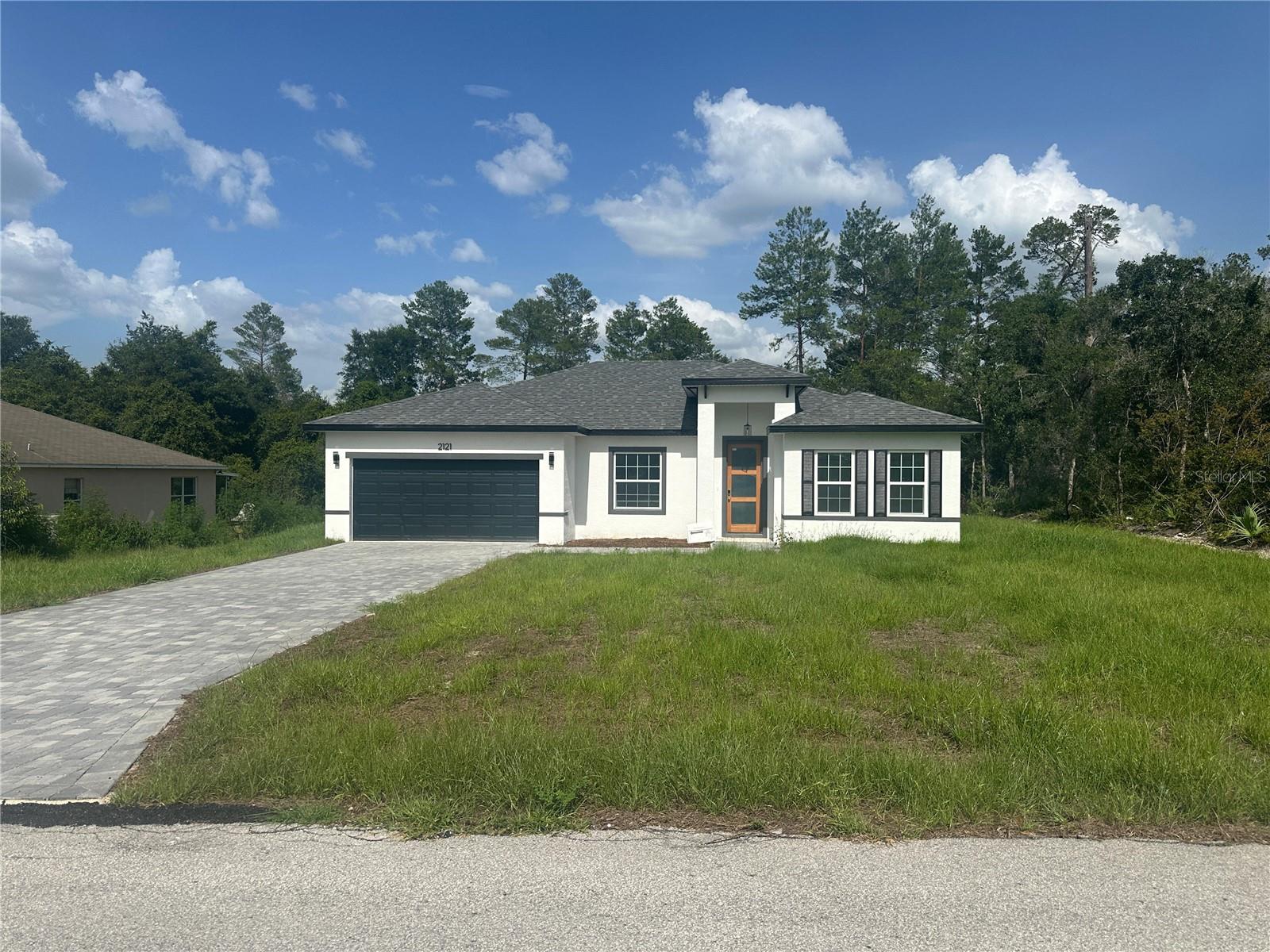 This brand-new house, located on UNIT 3 near the schools on a stunning in Marion Oaks, Ocala, represents an excellent opportunity for both living and investment! Positioned on an exceptionally well-located lot, the property stands out with its modern style, offering 4 cozy bedrooms and 2 bathrooms. Its spacious open layout is perfect for hosting large family gatherings, complemented by a fully equipped kitchen with stainless steel appliances, including a stove, refrigerator, garbage disposal, dishwasher and microwave, as well as an island and ample cabinet space. Both the kitchen and bathrooms are adorned with beautiful quartz countertops, while the Luxury vinyl flooring throughout all rooms and living spaces ensures easy maintenance. Schedule your visit today and discover the charm of living in a privileged location!