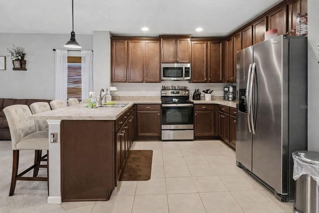 Photo of 9760 Kinmore Drive, Groveland, FL 34736 (MLS # O6395158)