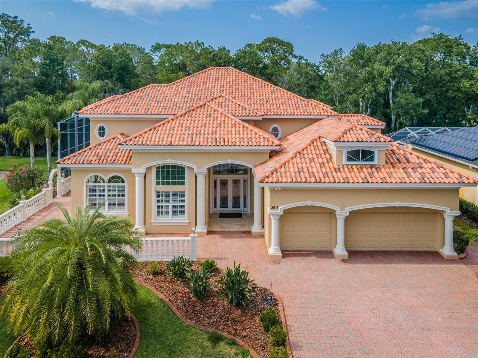 Welcome to this Spectacular home located in the desirable "Myrtle Point" subdivision, with in the Lansbrook Community of North Pinellas! This custom-built home sits on almost an acre of land with partial views of Lake Tarpon. As you enter thru the double doors of this magnificent home you will be greeted by a stunning foyer with soaring ceilings, marble flooring, tons of beautiful crown moldings, a grand staircase, and lots of natural light! This 4 Bedroom plus separate office and spacious game room
, 3 Full Baths and 2 half baths, and a 3-car garage home was built with such stunning elegance and architectural design that you will be in love with it within minutes of entering this home! The first floor of this home offers spacious formal dining and living rooms, a well thought out Kitchen plan that is sure to meet all your cooking needs, a large eat in kitchen space and huge family room with a gas fireplace that will be perfect for all of your family get togethers, a second master bedroom or 4th bedroom with its own bath that can also double for the pool bath, a large laundry room and storage closet, and lastly another half bath! Don't like stairs? No worries, just jump in the ELEVATOR and head upstairs! The second floor offers a gorgeous master retreat that will accompany the largest of bedroom furniture, a separate sitting area that has a beverage refrigerator so that there is no need to run downstairs for a refill, his and hers separate walk in closets with custom closet systems, and a luxurious spa like bathroom that has a full size jetted spa to relax in, a bidet, separate his and hers vanities, a linen closet and a magnificent balcony overlooking the pool area and to watch the sunsets on the lake! Additional features for the second floor are 2 other bedrooms, a full bath and a game room which is the perfect space for a movie or game nights with friends and family and half bath just outside the game room with a back staircase if you don't want to take the elevator! The grand staircase boasts an ornate custom designed wrought-iron railing that overlooks the foyer and formal rooms of this home! Outdoor living is equally impressive with the beautiful sparkling heated pool and spa, an outdoor kitchen that adds to the overall luxury and functionality of this expansive home. You will love entertaining outside with the tranquil views of the lake and beautiful sunsets! Lansbrook is known for its awesome walking & bike trails that go through the tree lined streets, a Lakefront Park on Lake Tarpon with a boat ramp, Public Golf Course, Playgrounds, basketball court, and soccer field! Go for a bike ride and sit at the Lakefront Park and enjoy the sunset over Lake Tarpon! The YMCA and John Chestnut State Park are located just outside the neighborhood. A home like this in the East Lake Area does not come available every day, so book your private showing today! Come enjoy the peace and serenity this gorgeous home has to offer!