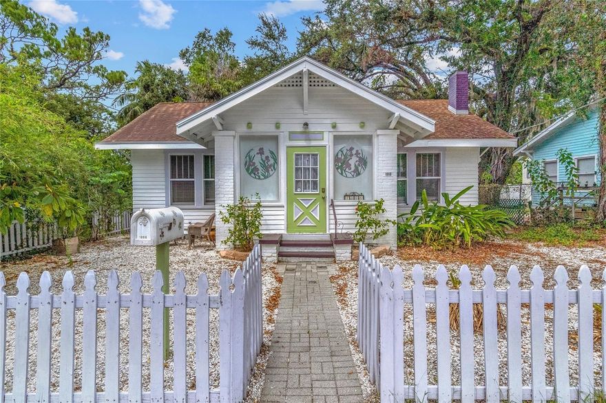 Charming Historic Cottage in the Heart of Bradenton’s Village Of The Arts! Zoned BR_T4-R for both residential and commercial use, this adorable early 20th-century bungalow offers the perfect balance of character, creativity, and opportunity. Painted in artsy lime green with purple accents, the home beautifully reflects the colorful personality of the neighborhood where galleries, cafés, and studios line the streets. Located just a few blocks south of downtown Bradenton, this historic gem is a short drive to some of Florida’s most coveted beaches and within walking distance to LECOM Park, home of the Pittsburgh Pirates’ spring training. Step inside and you’ll find all the vintage charm of a well-kept, 1930s bungalow paired with thoughtful updates for modern comfort. Original hardwood floors, built-in wood furniture, and large, wood-framed windows which flood the home with natural light. The spacious entryway features swing-out wood window display boxes, perfect for showcasing art or décor. The cozy living area includes a wood-burning fireplace and adjustable ceiling spotlights designed for highlighting artwork. The kitchen, open to the dining room, offers a gas stove, full-size refrigerator, dishwasher, microwave, and granite counters. Just off the kitchen, the laundry area includes a full-size washer and dryer. Both bedrooms feature ceiling fans, nicely sized closets, and easy access to the updated full bathroom, which includes artistic tilework and a pebble-finish shower floor. This property has passed its 4 point inspection, qualifying for insurance. Enjoy tranquility in the attached, covered, screened-in porch off the back. Outside, a lush, fully fenced backyard shaded by mature oak, kapok and bamboo trees offers a tranquil retreat. Follow the stone pathway past exotic flowers and wild vines to a serene, stone-framed pond tucked into the corner of the garden. A separate stand-alone 8' x 15' building with electricity and its own A/C unit provides the perfect art studio, workshop or office and has previously been rented to local artists for extra income. With no HOA and no minimum rental period, this property offers excellent investment potential for short-term vacation rentals. The Village of the Arts allows both artists and non-artists alike to live, work, and play among Bradenton’s most creative community. Enjoy the nearby bakeries, breweries, yoga studios, pottery shops, music venues, and award-winning restaurants, plus monthly Art Walks held every first Friday evening and first and third Saturday afternoons (and holidays) featuring live music and local vendors. As a bonus, homeowners in the Village of the Arts may qualify for city grants and incentive programs funding up to $2,500 for exterior upgrades, other home repair or down payment assistance. The city also provides free local electric car rides via the “Ride Freebee” app, offering easy access to downtown and the waterfront. This is more than just a bungalow- it’s a piece of living art. With its architectural character, live/work flexibility, and location in the city’s most creative and walkable district, it appeals to those who value lifestyle as much as structure. If you’re an artist, creative professional, or someone who wants a unique home in a vibrant community, this property offers a rare blend of charm and potential. With its mix of historic charm, creative energy, and modern convenience, this enchanting Bradenton bungalow is more than a home - it’s an experience!