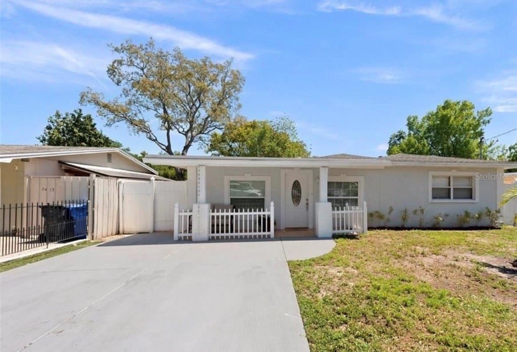 Photo of 7413 N Arrawana Avenue, Tampa, FL 33614 (MLS # O6432553)