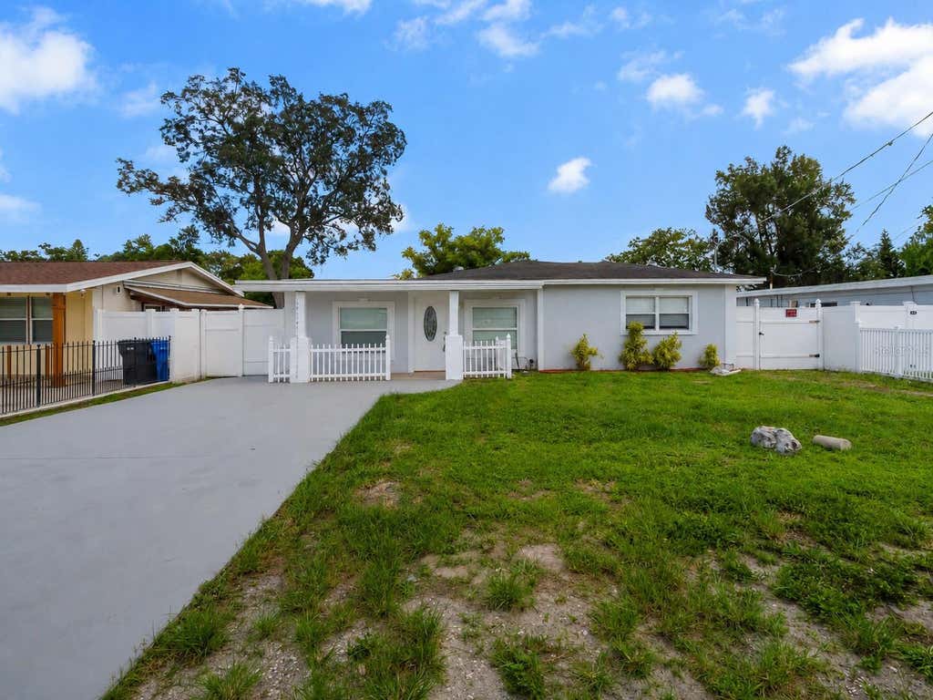 Photo of 7413 N Arrawana Avenue, Tampa, FL 33614 (MLS # O6432553)