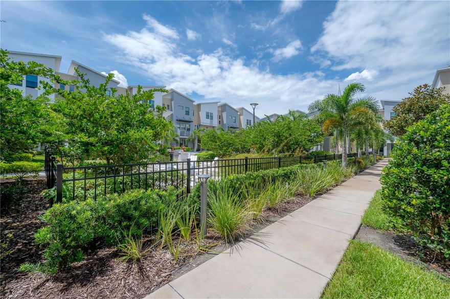 Nestled in a gated townhome community, this exquisite end-unit residence is strategically positioned just moments away from the vibrant heart of Downtown St. Pete and the world-class beaches of Pinellas County. Offering an abundance of natural light and enhanced privacy, this home features 3 bedrooms, 2 full baths, 2 half baths, and an attached, oversized 2-car garage, ensuring it caters to every aspect of your lifestyle. The first floor is versatile, serving as an ideal home office space with the convenience of a half bath. Ascending to the second floor, an open layout seamlessly connects the living, dining, and kitchen areas. Picture yourself on your private balcony, a serene oasis overlooking the shimmering pool and the inviting glow of the fire pit. Upgraded flooring graces every inch of this home, leading you to the heart of the residence, the kitchen. Adorned with a spacious island featuring exquisite quartz counters, this culinary haven is equipped with top-tier appliances, ensuring every meal is a delightful experience. A generous laundry room adds a practical touch, while an additional bonus space provides room for a secondary work area or creative haven. The community's amenities exemplify luxury resort living, featuring a year-round heated pool, an inviting fire pit, grilling stations for culinary enthusiasts, a dog park for furry friends, and a tranquil shaded area for ultimate relaxation. This townhome is more than a residence; it's a gateway to a lifestyle of unparalleled comfort and convenience. Pets are welcome at the owner's discretion - two pets max. In addition to the advertised base rent, all residents are enrolled in the Resident Benefits Package (RBP) for $50.00/month which includes HVAC air filter delivery, credit building to help boost your credit score with timely rent payments, utility concierge service making utility connection a breeze during your move-in, and much more! More details upon application. Occupied/Available 06/12/2026!