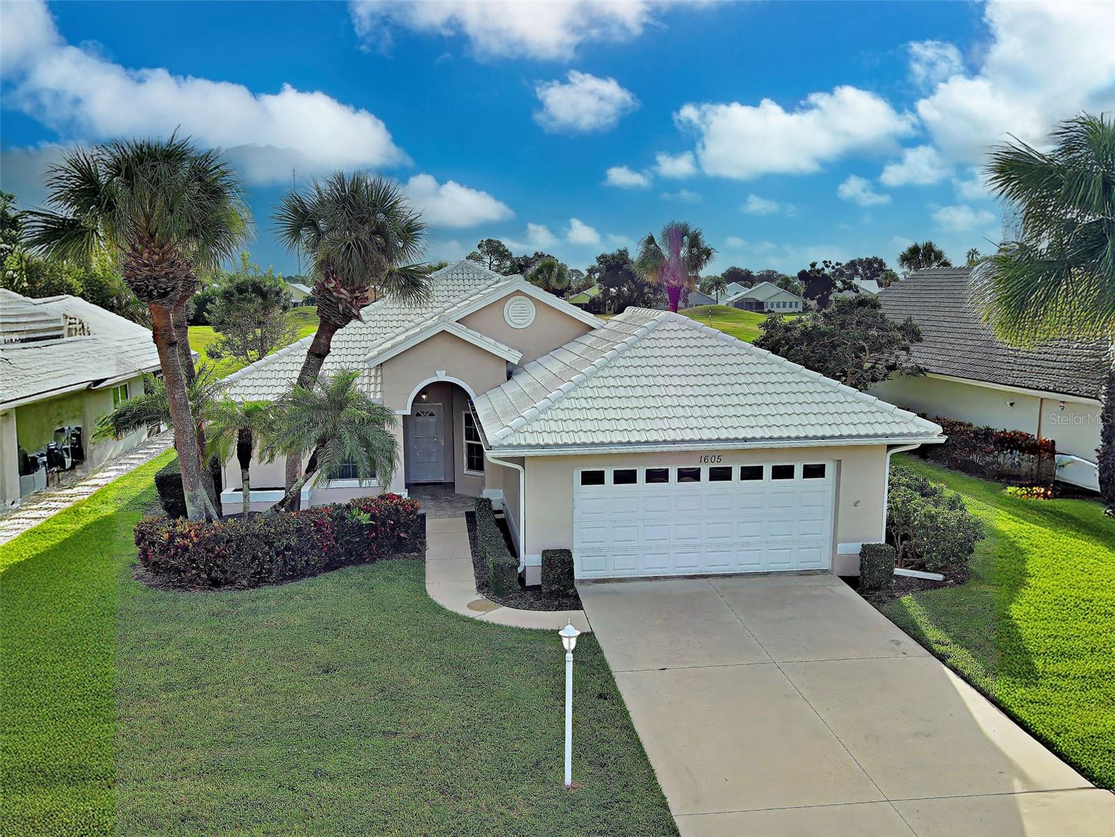 Enjoy resort style living in this single family golf course home in Waterford. Located on a "maintenance light" cul-de-sac, this home is perfect for either year round residents or snowbirds. At approximately 2,000 square feet of light filled living space, with two spacious bedrooms, a versatile den and two full baths all set on the serene backdrop of Waterford Golf Club. Step inside and feel the sense of openness and elegance. Hard surface flooring throughout, Hurricane Impact Windows, and an enclosed lanai with awesome views. Smart home features include wi-fi enabled ceiling fans, lighting and thermostat. Exterior painting was just completed in 2024, water heater replaced in 2023, tile roof is just 9 years young and home is located in flood zone X, so no flood insurance is required. Say goodby to yard work and enjoy the amenity rich community of Waterford. The clubhouse, hard-tru tennis courts (4), fitness center, pool, spa and "under construction" pickleball and bocce courts are right down the street. Waterford Gold Club is right here also, offering optional memberships or pay to play access along with a welcoming clubhouse that serves lunch daily. When it comes to location, it simply doesn't get much better. Gulf beaches and downtown Venice are just 4 miles away. Schedule your private showing today.