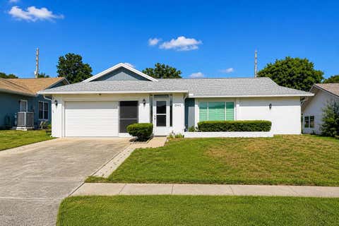 Photo of 2942 Macalpin Drive W, Palm Harbor, FL 34684 (MLS # TB8533663)