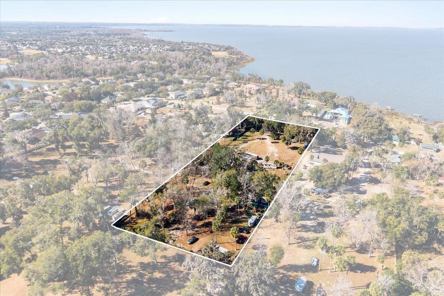 Welcome to your own piece of paradise across from Lake Apopka, where luxury lakefront estates directly across the street set the tone for this highly desirable location. Nestled in a quiet and established neighborhood surrounded by elegant custom homes, this expansive 0.95-acre homesite offers an exceptional opportunity to create a refined custom residence in a setting defined by quality and exclusivity.
This property stands out for its size, elevation, and proximity to the lake, making it ideal for a spacious custom estate designed to complement the surrounding luxury homes. It also offers flexibility for buyers seeking long-term potential in one of the area’s most attractive locations.
Two adjacent parcels are also available, providing the opportunity to combine properties for up to 2.85 acres in total—an ideal option for buyers seeking additional privacy, a larger estate, or future development possibilities. The land is high and dry, offering peace of mind and versatility for future construction.
Apopka, FL continues to experience strong growth, with a new entertainment district coming soon, further enhancing the area’s lifestyle appeal and long-term value. Conveniently located just minutes from the toll road (approximately 29 minutes), 10 minutes from the Downtown Winter Garden Food District, and 30 minutes from Disney World, this property offers the perfect blend of privacy, prestige, and accessibility.
Schedule your private showing today and explore the exceptional potential this homesite has.