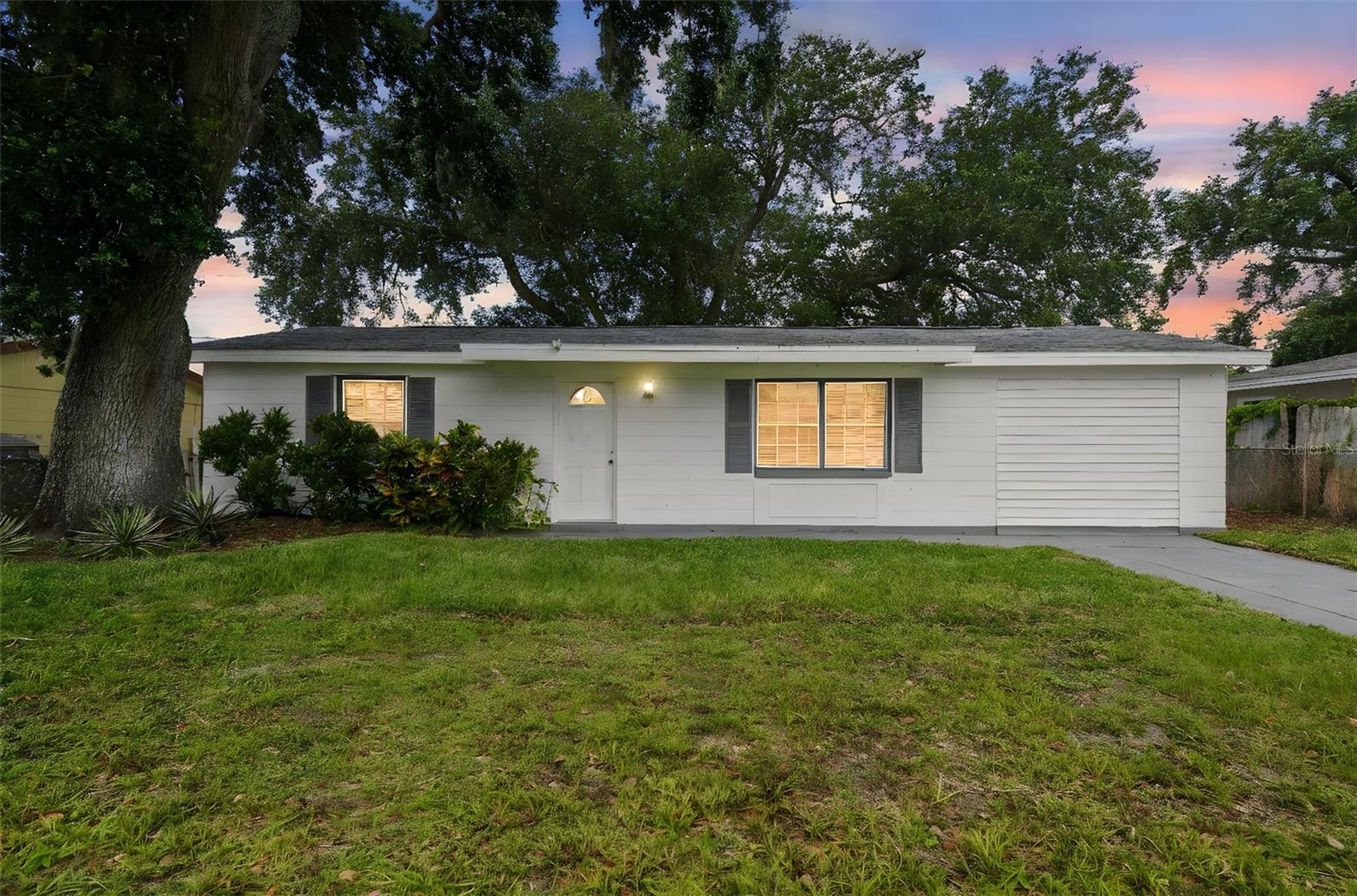 Move-In Ready Rental—No HOA, No Carpet, Allergy-Friendly! This beautifully renovated 4-bedroom, 2-bathroom home in Holiday, FL, features an in-unit washer and dryer, modern kitchen with quartz countertops, and updated bathrooms with quartz vanities. Enjoy waterproof luxury vinyl flooring throughout, promoting a cleaner, allergy-friendly environment with easier upkeep. The fully fenced backyard offers privacy and space for outdoor activities, while the large driveway accommodates up to three vehicles. Located just minutes from US-19 and serene escapes like Key Vista Nature Park, this home offers both convenience and tranquility. Ready for immediate occupancy—schedule your private tour today!