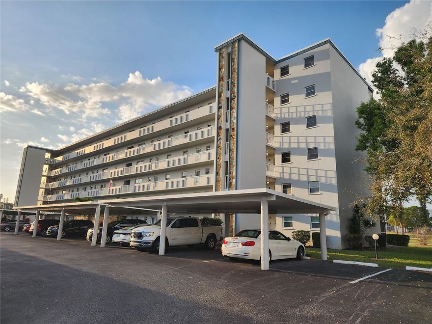 Location, location, CONVENIENT second floor END UNIT with panoramic GOLF COURSE VIEWS of the first hole fairway of Ironwood/Pinebrook golf course. Your assigned CARPORT is one of the first carports closest to your unit! Walk out your door for a very short walk to the Ironwood/Pinebrook golf clubhouse, and on the other end of the building, a short walk away, is the pool/clubhouse. Just across the street on Cortez Road is Publix, Aldi, dining, and more. Beautifully done complete NEW CUSTOM KITCHEN by Kirkplan with Fabuwood wooden cabinets and quartz counter tops. Butcher block work table in kitchen stays. Windows in condo have been replaced with double pane windows. NEW LAMINATE FLOORING throughout unit. Updated AC and hot water heater. Guest bedroom has a pull-down MURPHY BED with bookshelves, plus a remote controlled electric custom blind on the double window. Primary bedroom has a remote controlled electric custom blind, and an en-suite bath with walk-in shower. Screened and glass enclosed lanai. Laundry room and extra storage room are located by the elevator on your floor. Third floor has a large resident storage space and sixth floor has a meeting room. This unit has upgrades, excellent floor plan, view, and location, don't miss showing it today. PROFESSIONAL PHOTOS TO BE POSTED SOON.