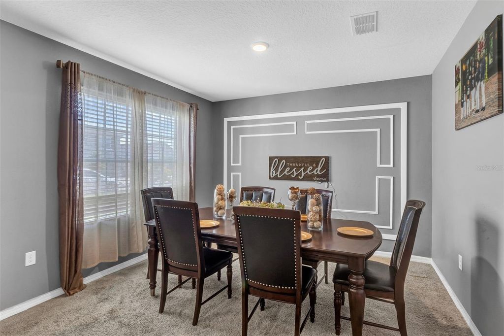 Photo of 269 Ludisia Loop, Davenport, FL 33837 (MLS # O6359603)