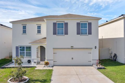 Photo of 269 Ludisia Loop, Davenport, FL 33837 (MLS # O6359603)