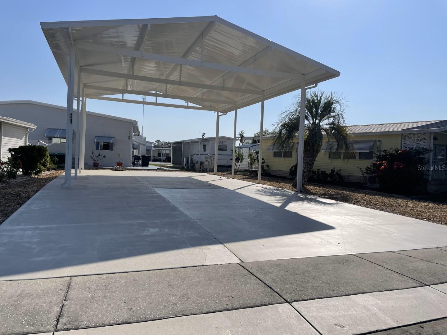*** Improved Price*** Owning your own RV site is more economical than parking at a campground!! Great for year-round living or for snowbirds this lot is located in the 55+ gated community of American Condominium Park. The lot is level concreted and has an engineering designed full roof-over to accommodate your RV with full hook-ups. Or bring in a Park Model home for more permanent full-time living. American Condominium Park has many amenities, some of which include a heated pool, shuffleboard, pickleball and tennis courts, clubhouse, exercise room and more. The active community has daily, weekly, and monthly activities which include dances, dinners, entertainment and much more. Call today to schedule your chance to own this lot!