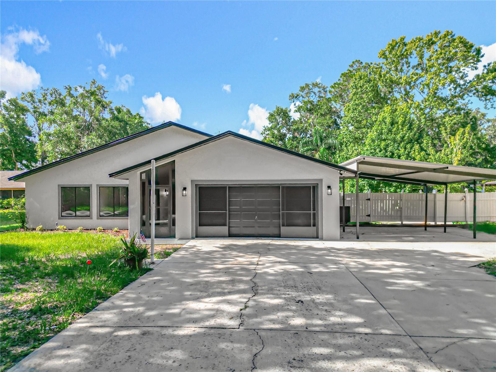 Attention BOATERS, SUNSEEKERS, and LAKE LOVERS — welcome to 28432 Tammi Dr, Tavares, FL!
This exceptional fully remodeled waterfront home delivers the ultimate Florida lifestyle with canal frontage to Lake Dora, a brand-new pool and deck, and a private L-shaped boat dock currently under construction—scheduled for completion before closing.
Set on an expansive lot, this beautifully upgraded 3-bedroom, 2.5-bathroom home also features a dedicated office that can easily function as a 4th bedroom, perfect for growing families or guests. Inside, you’ll find luxury vinyl plank flooring, fresh interior and exterior paint, and an open-concept kitchen outfitted with new soft-close cabinetry, waterfall quartz countertops, and new stainless steel appliances.
The primary suite offers a serene escape with a fully updated en-suite bathroom that includes a custom makeup station, adding a touch of everyday luxury. All bathrooms have been retiled with elegant, modern finishes.
Step outside to your private oasis—featuring a newly constructed pool and a stylish half bathroom with a wood-accented seating and changing area, ideal for guests and poolside comfort. Whether lounging by the pool, entertaining, or preparing for a day on the water, this space is designed for relaxation and convenience.
Additional upgrades include a new roof, new AC, updated lighting and fixtures, and ample storage with a 2-car garage and carport. With no HOA and room for boats, RVs, or golf carts, this home offers unmatched flexibility and lifestyle potential.
Enjoy direct boat access to the Harris Chain of Lakes from your own backyard—ideal for fishing, cruising, and waterfront sunsets.
Don’t miss your chance to own this turn-key waterfront gem—schedule your private showing today and experience the best of lakefront Florida living!