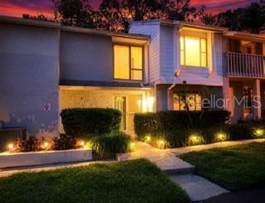 Welcome home to this beautifully renovated 2 story, 3 bedroom, 2 1/2 bath condo in the sought out community of Crown Point By The Springs!! Lovingly cared for and meticulously maintained, this condo exudes pride of ownership. This home offers a spacious kitchen with beautiful travertine flooring, newer stainless steel appliances, ample wood cabinetry and generous counter space. Slide the charming barn door to reveal the conveniently tucked away washer and dryer. Flowing seamlessly from the kitchen is a bright, inviting dining room with effortless care luxury vinyl flooring. French doors open to your private fenced pavered patio, the perfect spot to relax and unwind. The living room features a charming wood burning fireplace and elegant plantation shutters on the windows, creating a warm and elegant atmosphere. A half bath is also located conveniently on the first floor. Upstairs, a lighted built-in bookshelf accents the hallway, leading to three bedrooms and a guest bath. The spacious primary suite has a walk in closet and sliders that lead out to the balcony, which provides a luxurious view of the surrounding trees for peaceful enjoyment.  The primary bath boasts a soothing, spa-inspired design. This condo has been updated with a re-pipe, electric panel and water heater (2022). Enjoy the community pool which is a short walk away. Just 3 miles from Wekiva State Park with the famous Wekiva Island! Enjoy shopping and a variety of restaurants within a short walk. Centrally located, just a few miles from Seminole College and I-4, with easy access to Orlando's world famous theme parks and beaches. You will not want to miss out on this lovely gem so make your appointment today for a private showing!