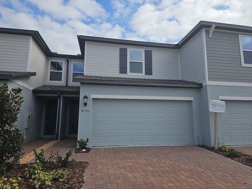 Brand-new construction townhome in the heart of St. Cloud—perfectly positioned near Florida’s Turnpike for easy commuting and access to all of Central Florida. This 1,566 sq. ft. home offers 3 bedrooms, 2.5 bathrooms, and a versatile loft space ideal for a home office, reading nook, or study area. The west-facing orientation provides warm afternoon light and beautiful sunset views.
Step inside to an open-concept layout featuring laminate flooring throughout the first floor and tile in all bathrooms and the laundry room. The kitchen showcases modern white 42" upper cabinets, sleek quartz countertops, and a stylish tile backsplash—creating a clean, contemporary look. Large windows fill the home with natural light, and blinds are already installed for added convenience.
The community offers fantastic amenities, including a resort-style pool with clubhouse, two playgrounds, and scenic walking trails, providing plenty of options for relaxation and outdoor enjoyment.
Located in a growing area of St. Cloud, you’ll enjoy quick access to shopping, dining, parks, and lakes. The community is just minutes from Lakefront Park, Historic Downtown St. Cloud, and major retail corridors. Even more exciting—a new high school is planned for the area, adding long-term value and convenience.
Move-in ready and designed for low-maintenance living, this townhome offers the perfect blend of comfort, style, and location.