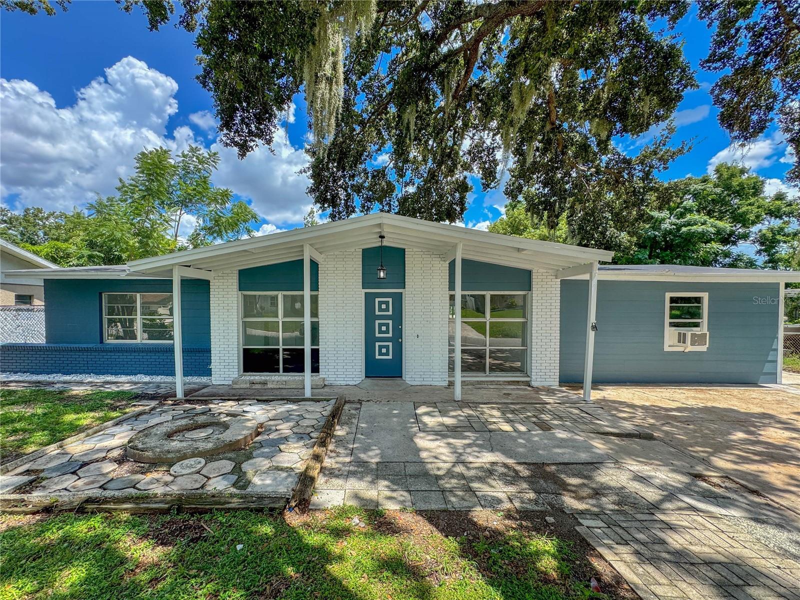 Welcome to 2511 Sandy Lane, where every detail has been thoughtfully remodeled. Start your mornings with coffee on the back patio as the sun rises over your sparkling pool, or unwind at sunset in your private backyard oasis. Inside, enjoy new vinyl flooring, plush carpet in the bedrooms, and a modern kitchen with new cabinets and granite countertops. The converted garage under air and a bonus room with private entrance provide flexible living—perfect for in-laws, guests, or rental income. With a new roof, water heater, electrical panel, fresh paint inside and out, and updated landscaping, this home offers comfort, style, and peace of mind in a central Orlando location.