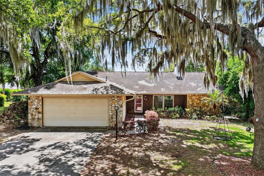 Welcome home to the sought after community of Springwood Landing!  This inviting 3/2 pool home rests on on nearly a 1/2 acre lot on a quiet cul-de-sac, providing privacy, space to roam and a low traffic setting perfect for families or entertaining.  Step inside to discover beautiful wood floors that flow throughout the main living areas, creating a warm and timeless ambiance.  The heart of the home shines with the spacious Living Room centered by the wood burning fireplace in addition to a wet bar with granite counter.  The kitchen features granite counter tops, stainless steel appliances and a large eat-space.  The primary bedroom also boasts hard wood floors and opens up to the screened-in porch area.  The master bath has a walk-in shower and a large walk-in closet with built ins and shelving.  The split bedroom floor plan includes bedrooms 2 and 3 on the other side of the home with a second bath between them which has a tub/shower and granite counter top.  The inside laundry room is located just off the oversized 2 car garage.  New double pane windows and sliding doors were installed in 2014 for improved energy efficiency, plus a new A/C in 2022!  Outside, your private pool awaits - perfect for cooling off on hot days, weekend barbecues, or simply relaxing in your back yard oasis.  The expansive lot also has a large shed, fruit trees and offers plenty of room for gardening, play or future additions.  This peaceful, family-friendly community includes access to the Lake Harris Chain of Lakes as well as a park/playground and a tennis court!  Enjoy being just minutes away from Downtown Eustis and all of your dining and shopping needs!  Don't miss your chance, schedule a showing before this gem is gone!