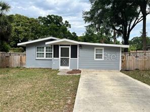 What a great place to call home. Conveniently located in Zephyrhills city limits and walking distance to downtown. The property features front and rear entry access. The backyard is fully privacy fenced with a large double-gate to allow vehicle entry. **Roof just replaced in 2025.** The home was recently remodeled with features including 12x24 tile in the entire home, newer kitchen and bathroom cabinets, hardware, granite counters, sinks, toilets and more. The Kitchen features a bar, stainless steel appliances. Both bedrooms and bathrooms are spacious. Each bathroom has dual sinks. Laundry room and newer AC. The backyard is very spacious for whatever you desire. No HOA. Hurry, this one is nice!!