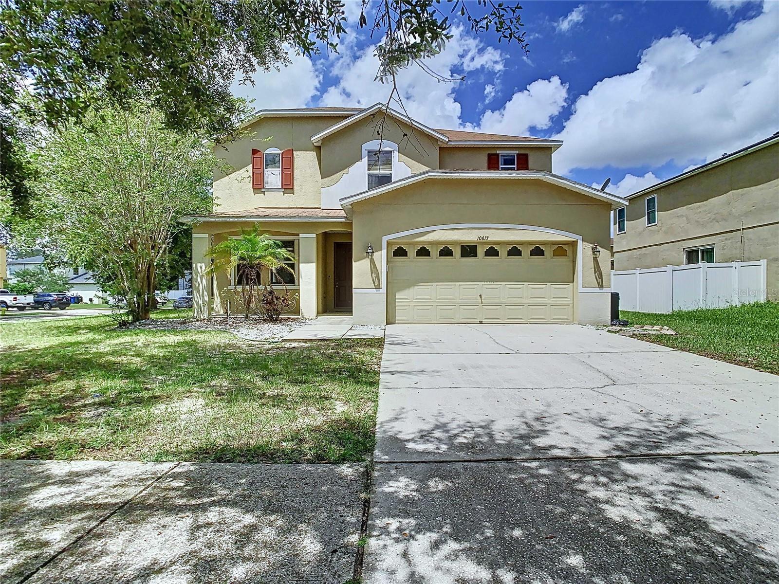 (Assumable FHA loan with low interest rate available) This beautiful two-story home sits on a spacious corner lot, featuring 4 bedrooms, 2.5 baths, and a two-car garage. The home welcomes you with a covered front porch and an impressive 8-foot-high entry door. Inside, the first floor boasts Spanish lace volume ceilings and diagonal designer ceramic tile flooring, creating a bright and open atmosphere. The large living room includes a decorative cut-out wall divider that opens to the family room, which is illuminated by a triple window view of the manicured grounds. The gourmet kitchen is a highlight, with 42" maple cabinets accented with crown molding, granite countertops, a stainless undermount sink, stainless steel appliances, and a large walk-in pantry. The adjacent dining area features 8-foot-high sliding glass doors leading to the backyard. A private hallway on the first floor includes an under-stair storage closet and a guest half bath. The inside utility room offers washer/dryer hookups, storage shelving, and a security keypad. Ascending to the second floor via an elegant staircase with a wood banister railing, you'll find a spacious hallway leading to an expansive master suite. The master suite features a tray ceiling, a relaxing master bath with a garden tub, a walk-in shower, and a double sink vanity with maple cabinets and a solid surface counter with an integrated sink. The master closet is generously sized at 12' x 10'. The second floor also includes three additional well-sized bedrooms and a full second bath. Additional features of this magnificent home include a two-car garage with an automatic opener, a sprinkler system control center, and carriage lights. The home is strategically located on a great corner lot at the south end of the circle, offering both convenience and privacy. The roof is in 2014, the AC in 2012, and the water heater is in 2023. Please Schedule your showing today.