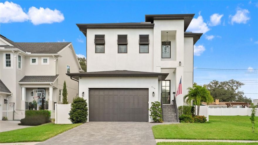 A rare opportunity on Davis Islands — this modern 2020 residence delivers the perfect blend of contemporary design, luxury finishes, and immediate move-in convenience. While much of today’s island inventory is still under construction, this 3,725-square-foot home is complete, meticulously maintained, and ready to enjoy. Just steps from the Davis Islands Village and trail, it combines exceptional walkability with the comfort of a thoughtfully designed floorplan.

Inside, the open first floor welcomes you with soaring 12-foot ceilings, espresso wide-plank wood floors, and walls of windows and sliders that flood the space with natural light. The gourmet kitchen features fine white cabinetry, quartz countertops, a large center island, and premium Sub-Zero, Bosch, and GE appliances — all opening seamlessly to the spacious dining and living areas. A downstairs guest suite provides ideal flexibility for family or visitors.

Upstairs, a versatile loft creates the perfect spot for recreation or a quiet retreat. The expansive primary suite is a true retreat with oversized picture windows, a luxurious spa-inspired bath featuring a soaking tub, frameless glass walk-in shower, dual vanities, abundant storage, and two impressive walk-in closets. Three additional bedrooms each include their own private en suite baths, and an oversized laundry room adds convenience to everyday living.

Designed for year-round entertaining, the outdoor living spaces include a covered lanai with a fully equipped summer kitchen — featuring a gas grill, a separate tandoori grill, a sink, and a beverage fridge — as well as two elevated decks and a micro splash pool, perfect for cooling off on warm Florida days.

This residence is also equipped with integrated smart home technology, allowing you to control lighting, climate, and more through Google Home for effortless convenience.

Located on the picturesque Davis Islands, this home offers an unparalleled lifestyle in a vibrant, walkable community favored by professional athletes, executives, and families alike. The neighborhood is home to a wealth of amenities, including Marjory Park Marina, the Sandra Freedman Tennis Complex, the historic Roy Jenkins pool, and Peter O. Knight Airport. A short stroll brings you to the Davis Islands Village, where you’ll find a variety of restaurants and shops. With its prime location just minutes from Downtown Tampa, Water Street, Sparkman Wharf, and the Tampa Riverwalk, this home truly offers the best of both island living and urban convenience. Additionally, it is situated within the boundaries of the highly rated Gorrie Elementary, Wilson Middle School, and Plant High School.