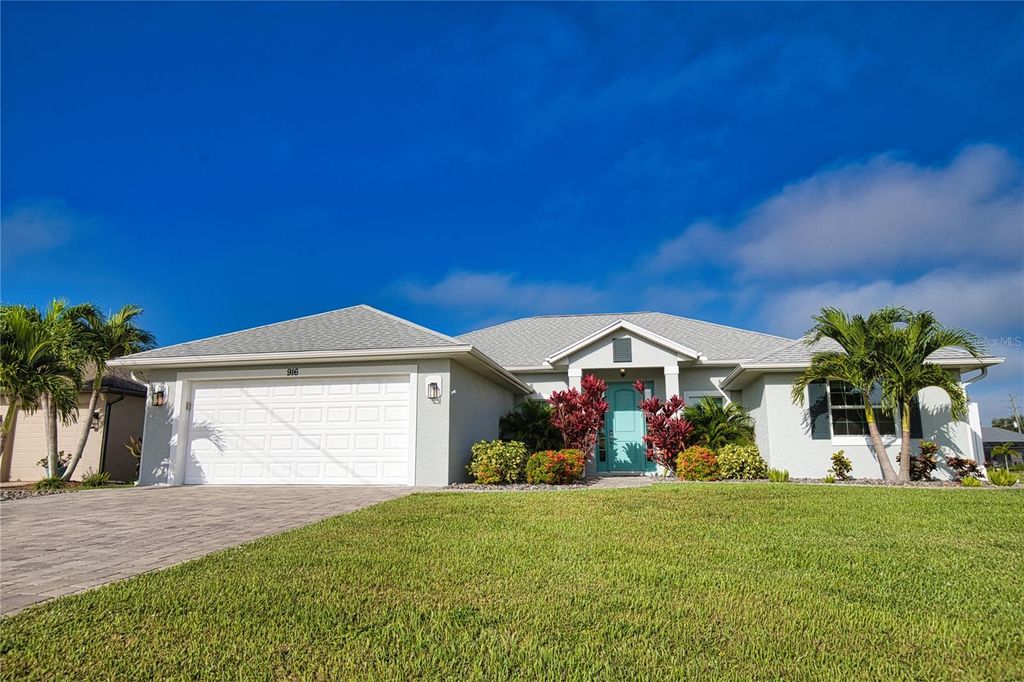 Photo of 916 Boundary Boulevard, Rotonda West, FL 33947 (MLS # O6399084)